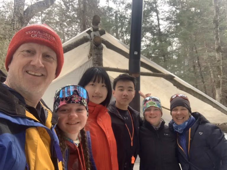 Group in front of a winter wall tent during a winter Duke of Edinburgh expedition