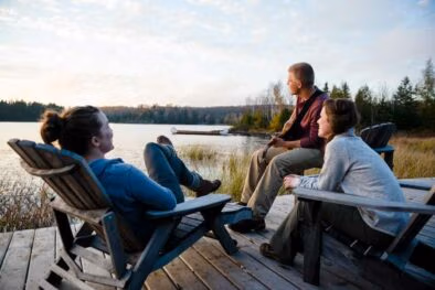 relaxing on the deck at the Algonquin Log Cabin